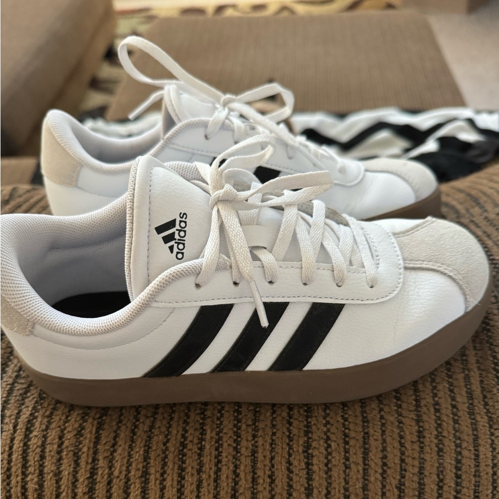 Adidas. These are kids size 5 but fits ladies 6.5